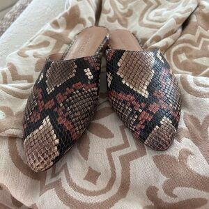 Madewell snake patterned leather mules.